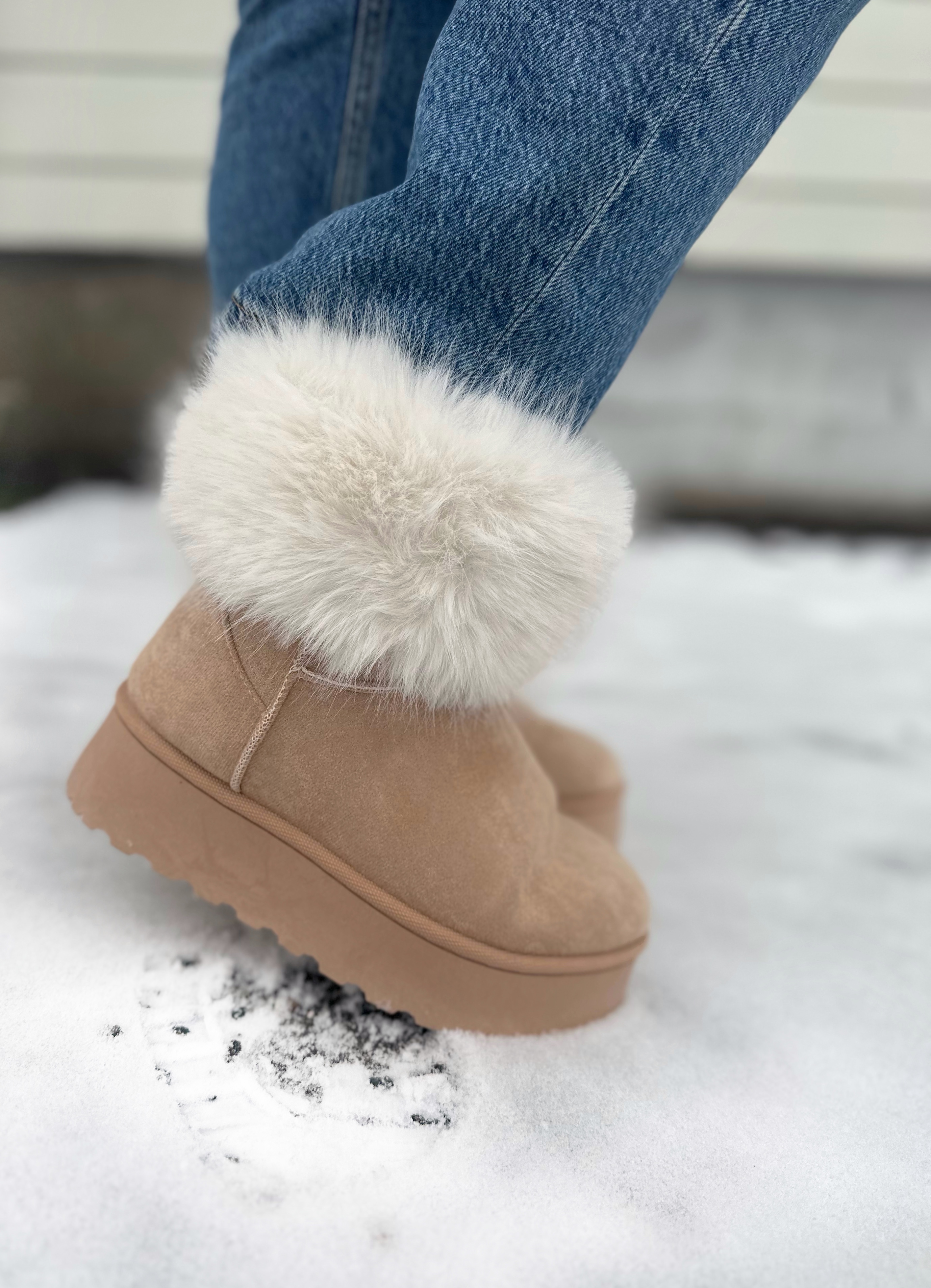 Furry boots with pom on sale poms